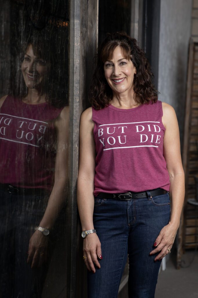 photo of Gina Forcatto in front of a window wearing a tank: but did you die